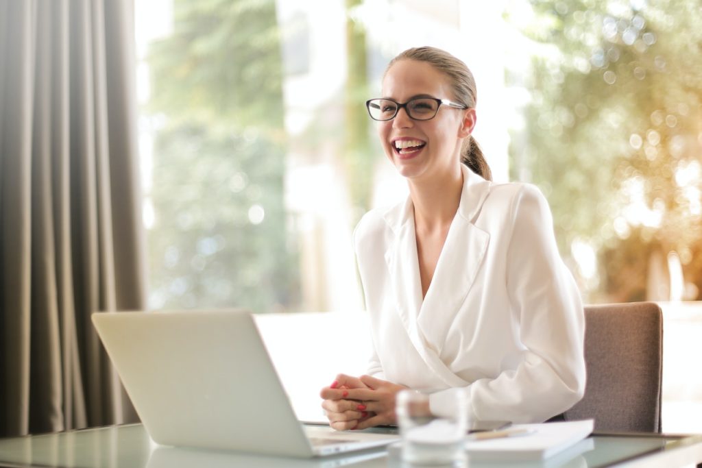 happy woman at computer